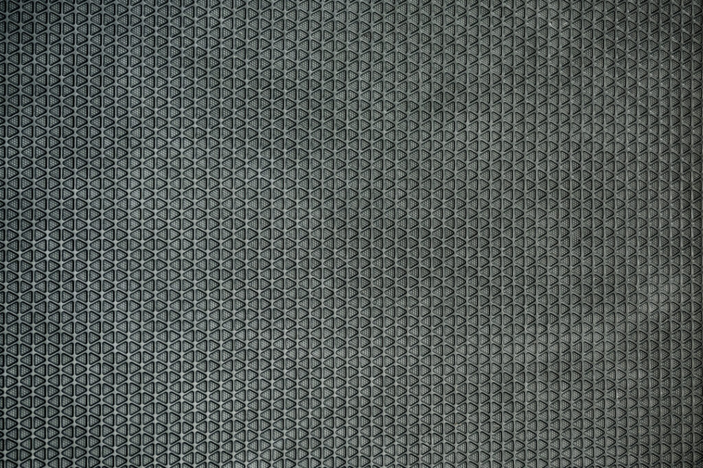 Imagem em close up de um tapete, feito de poliuretano.